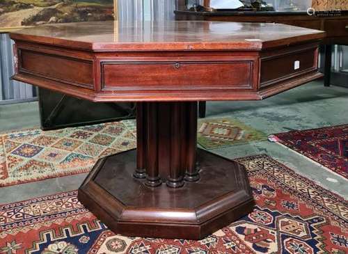 19th century mahogany octagonal-topped rent table, the plain edge above four drawers, on a single