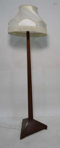 20th century mahogany standard lamp, the column of triangular cross-sectional form on triangular