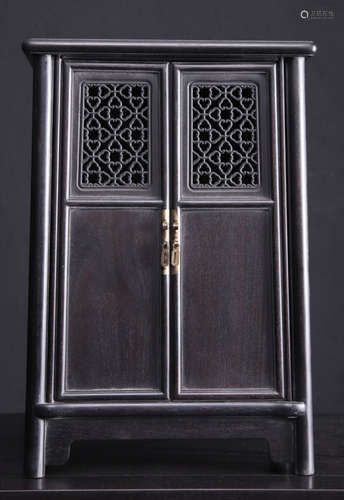 A ZITAN WOOD CARVED RUYI PATTERN CABINET