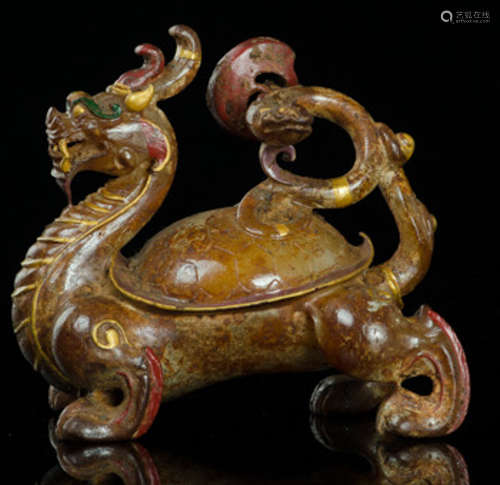 AN ANTIQUE JADE CARVED BEAST SHAPE PENDANT