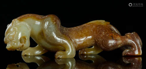 AN ANTIQUE JADE CARVED BEAST SHAPE PENDANT