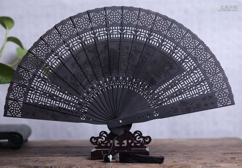 A ZIGUANG TAN WOOD CARVED FLOWER PATTERN FAN