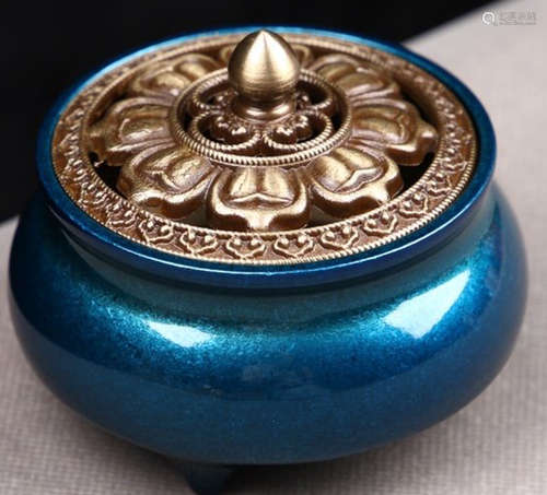 A COPPER CAST FLOWER PATTERN CENSER