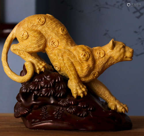 A HUANGYANG WOOD CARVED BEAST SHAPE PENDANT
