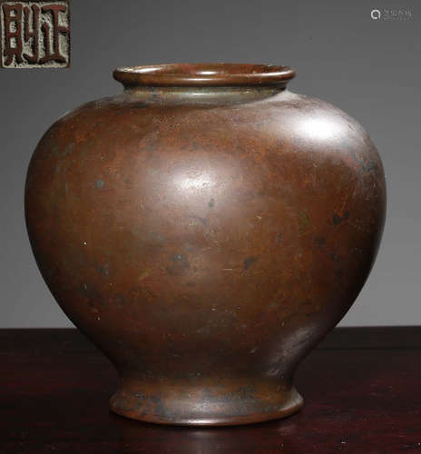 A COPPER CAST VASE