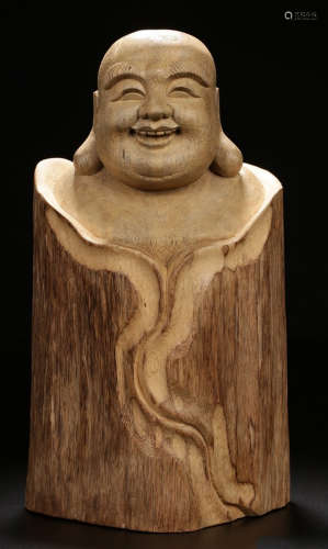 A TIANXIANG WOOD CARVED MAITREYA