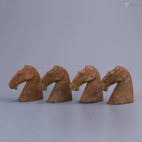 A set of terracotta painted horse heads