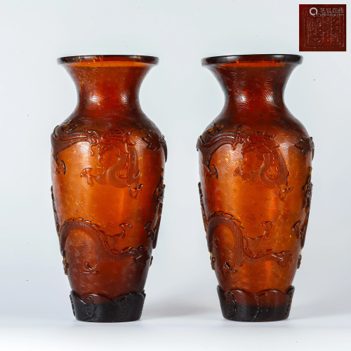 A pair of Qianlong carved dragon glaze vases i…