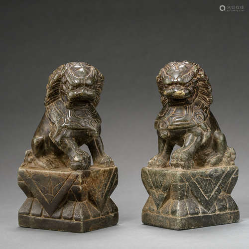 A PAIR OF ANCIENT CHINESE BLUESTONE LIONS