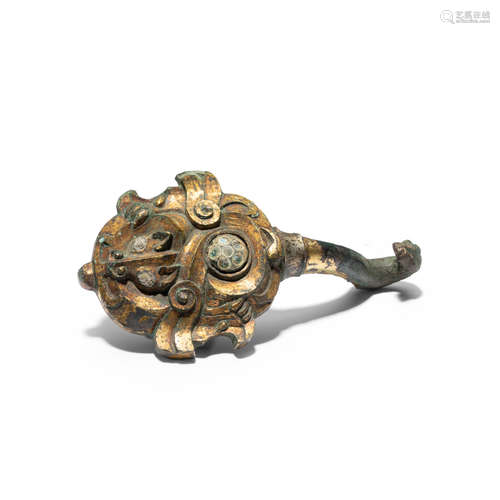 A rare inlaid gilt bronze belt hook Warring States period