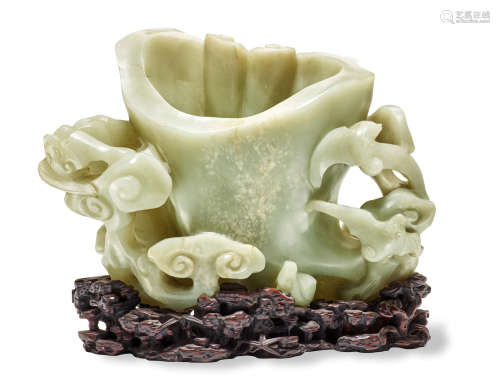 A CARVED Celadon Jade 'ruyi' form Brush Washer Qianlong/Jiaqing Period