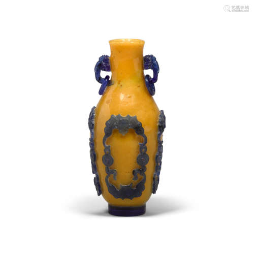 An opaque yellow glass and blue-overlay 'BATS AND CASH' VASE 1750-1850