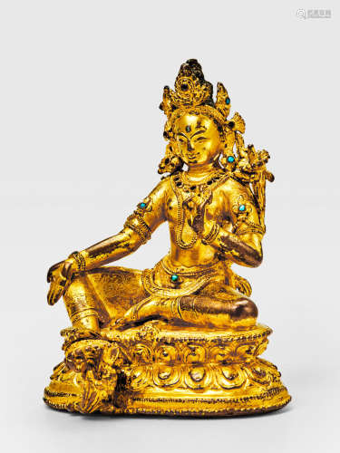 A GILT COPPER ALLOY FIGURE OF GREEN TARA NEPAL, 14TH CENTURY