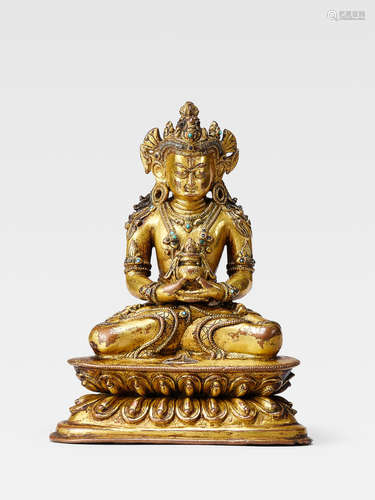 A SILVER INLAID GILT COPPER ALLOY FIGURE OF AMITAYUS NEPAL, CIRCA 14TH CENTURY