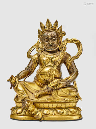 A GILT COPPER ALLOY FIGURE OF YELLOW JAMBHALA QING DYNASTY, 18TH/19TH CENTURY