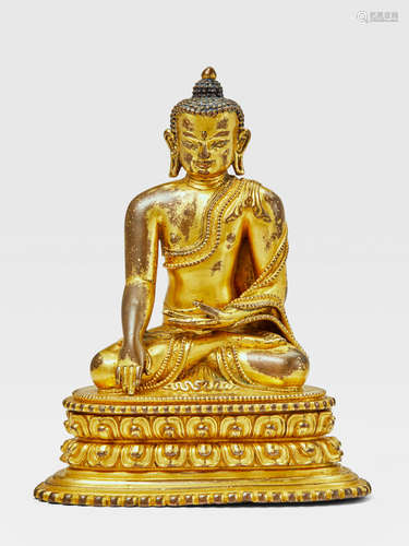 A GILT COPPER ALLOY FIGURE OF BUDDHA NEPAL, 14TH CENTURY