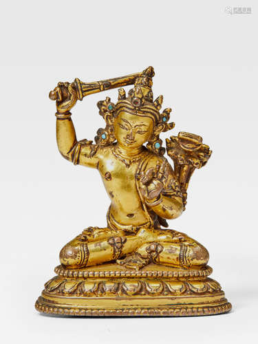 A GILT COPPER ALLOY FIGURE OF MANJUSHRI TIBET, 13TH/14TH CENTURY