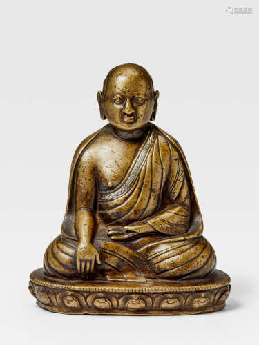 A SILVER INLAID COPPER ALLOY FIGURE OF A KAGYU HIERARCH TIBET, 13TH/14TH CENTURY
