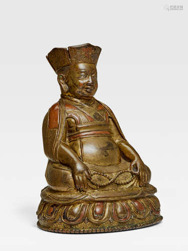 A COPPER INLAID COPPER ALLOY FIGURE OF SONAM ZANGPO TSANG, CENTRAL TIBET, 15TH CENTURY