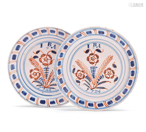 A pair of London delftware plates, dated 1724