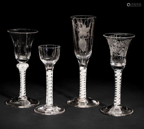 Three opaque twist wine glasses and an ale glass, circa 1765