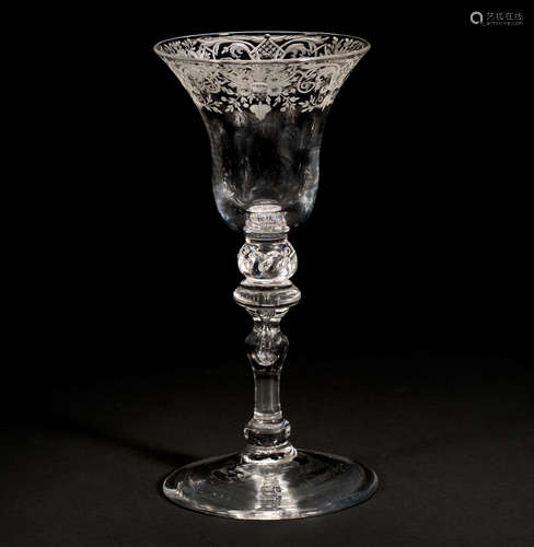 An engraved light baluster wine glass, circa 1750