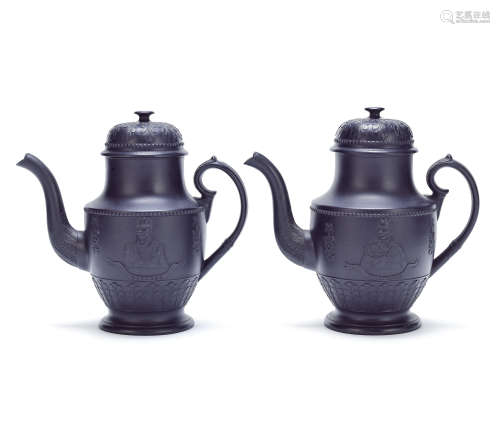 A pair of black basalt commemorative coffee pots and covers of Wellington interest, circa 1815