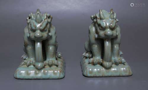 A Pair Of Ruyao Porcelain Lions