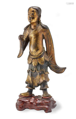 A Gilt-bronze Figure of a Standing Immortal Ming dynasty