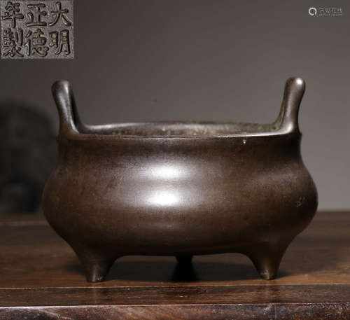 A COPPER CASTED TRIPOD CENSER