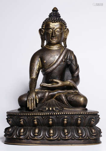 A COPPER WITH SILVER SAKYAMUNI BUDDHA STATUE