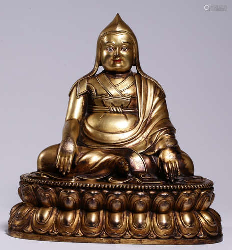 A GILT BRONZE CAST TSONGKAHAPA STATUE