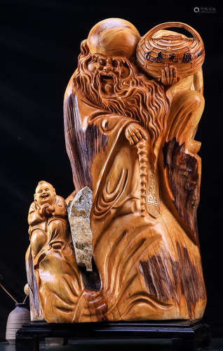 A YABAI WOOD CARVED BUDDHA SHAPE ORNAMENT