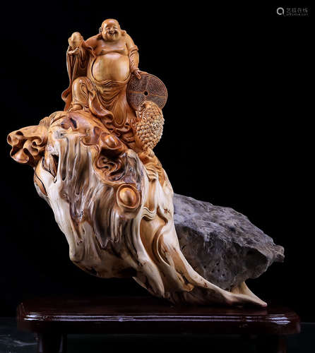 A YABAI WOOD CARVED MAITREYA BUDDHA ORNAMENT