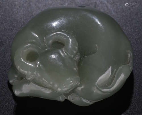 A HETIAN JADE CARVED BULL SHAPE PENDANT