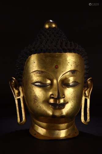 A Chinese Gilt Bronze Buddha Head Ornament