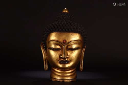 A Chinese Gilt Bronze Buddha Head Ornament