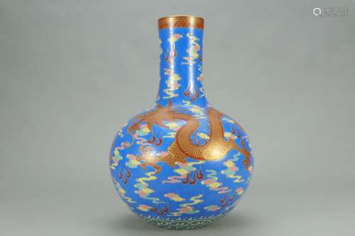 A Chinese Blue Glazed Famille Rose Bottle Vase