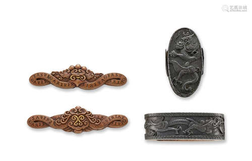 A pair of shakudo Nanban-style fuchi-gashira and a pair of copper nanban-style menuki Edo period (1615-1868), 19th century