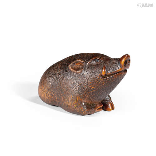 Sakai Masami (born 1937) A wood netsuke of a seated boar Showa era (1926-1989), circa 1980