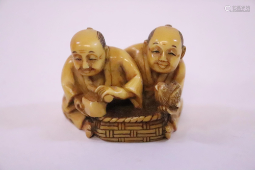 A Japanese bone carved netsuke 