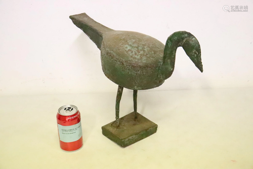 A bronze duck, a decoy?