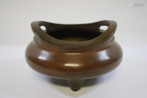 A bronze open censer