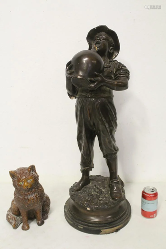 A casted boy figure with water jar, a casted cat