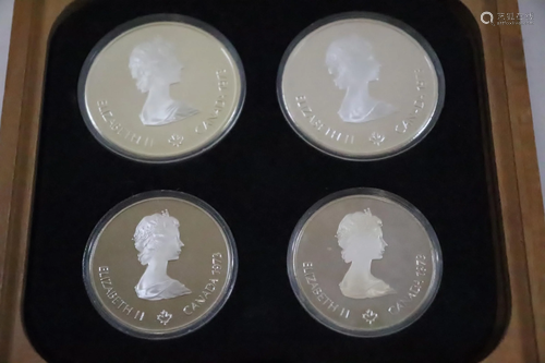 Set of 4 sterling silver coins