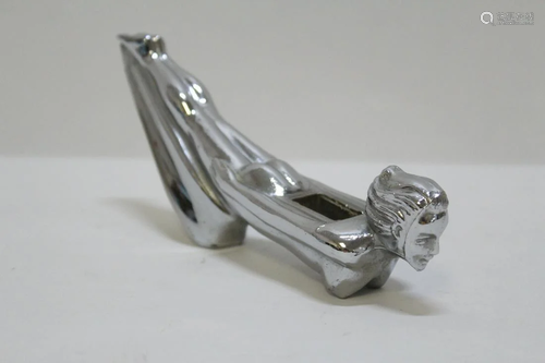 A chrome vintage car hood ornament