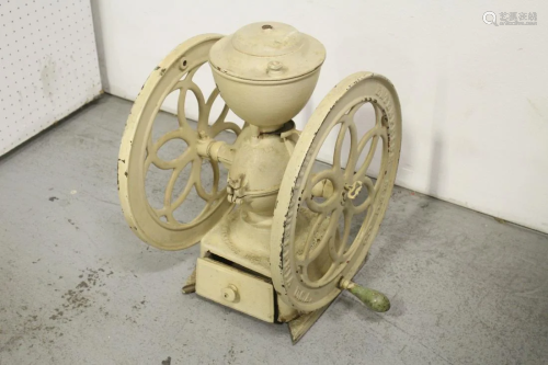 A cast iron coffee grinder