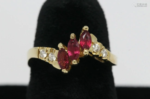 14K Y/G ruby ring accented by diamonds