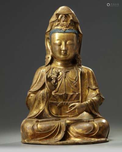A LARGE CHINESE GILT BRONZE FIGURE OF GUANYIN, 19T…