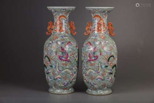 A PAIR OF CHINESE FAMILLE ROSE 'NINE DRAGON' VASES…